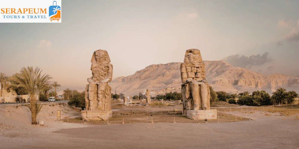 Luxor Travel Guide: Temples, Tombs & Tips for First-Time Visitors Two giant statues of Colossi of Memnon in Luxor Egypt