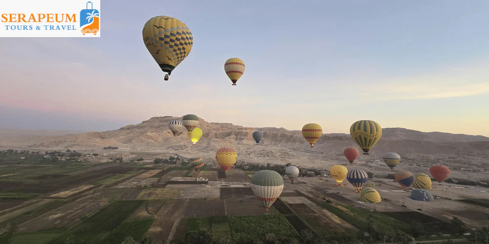Luxor Travel Guide: Temples, Tombs & Tips for First-Time Visitors Hot air balloons flying over Luxor at sunrise Egypt