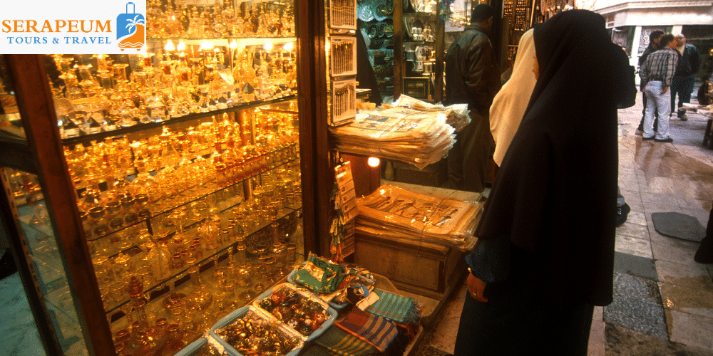 Khan El Khalili Guide: What to Buy, Prices, Tips & Things to See Traveler browsing souvenirs while shopping in Khan El Khalili Cairo
